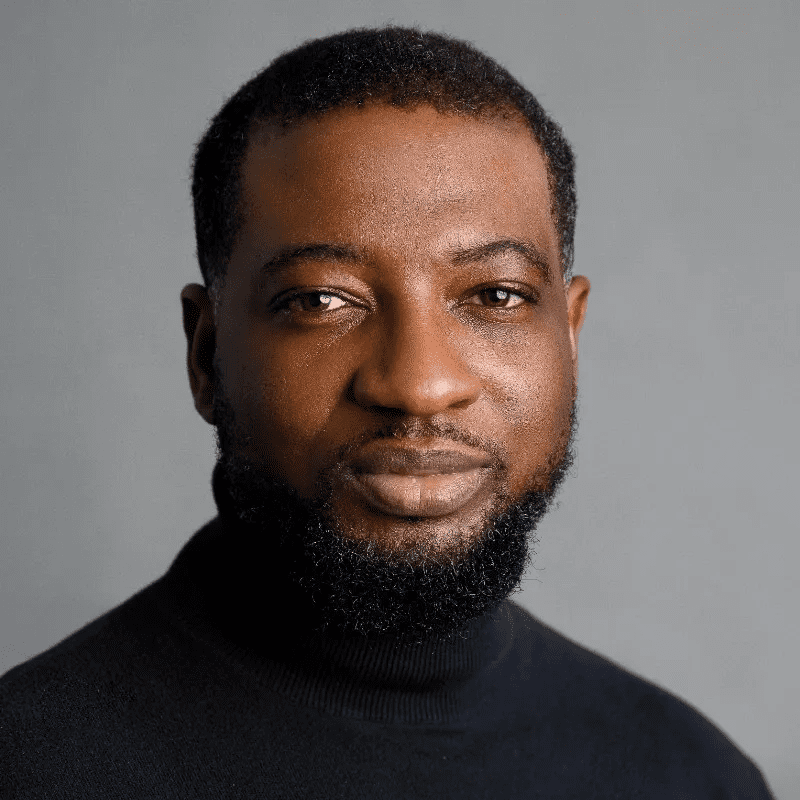 A man with a beard wearing a black shirt.